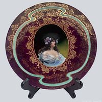 Front view of entire charger plate on stand displaying full design