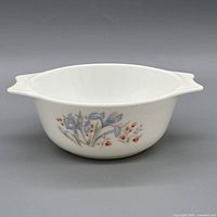 Side view of bowl showing floral pattern and handles