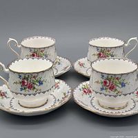 Set of four teacups with four saucers displayed
