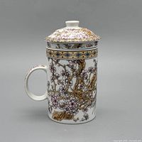mug assembled with lid, bird side partially visible