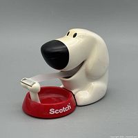 Front view of Scotch dog tape dispenser with tape extended