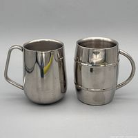 Both stainless steel tankards front view