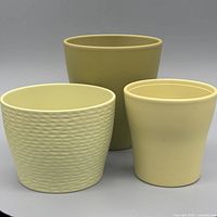 All three ceramic planters grouped together showing size and color differences