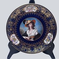Front view of Sevres cobalt blue porcelain plate showing full design