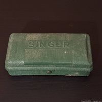 Closed green Singer case