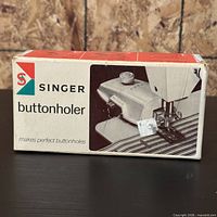 Front of Singer buttonholer box