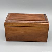 Closed solid wood box showing lid design and finish
