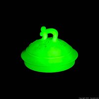 Lid glowing bright green under UV light