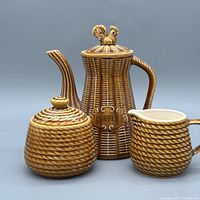 Front view of full three-piece coffee set