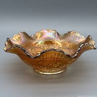 Full view of bowl showing ruffled rim and iridescent finish