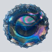 Top view showing diamond hobnail pattern, starburst centre and overall iridescence