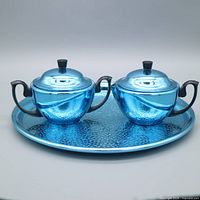 Full three-piece set on round tray, front view