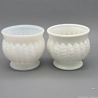 Pair of milk glass planter bowls front view