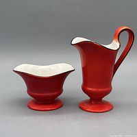 Front view of creamer and sugar bowl set showing color and form