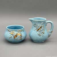 Creamer and sugar bowl front view