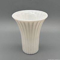 Front view of white milk glass ribbed fluted vase