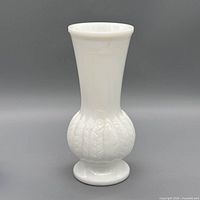 full view of white milk glass vase