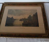 Front view of framed lithograph showing artwork, mat and ornate gilded frame