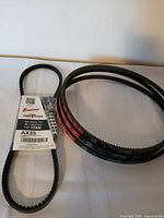 Four Browning AX35 belts, one with factory sleeve