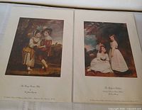 Both lithograph prints side by side
