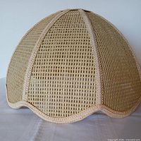 Exterior view of beige rattan dome shade with scalloped edge