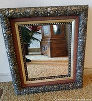Front view of ornate framed mirror
