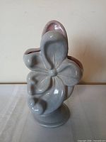 Front view showing magnolia relief and blue glaze