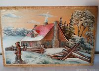 Front view of carved wood winter scene plaque showing full composition