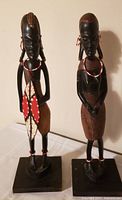 Front view of both Maasai carvings on bases