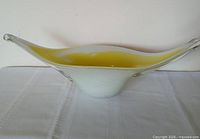 Side profile showing full length, yellow interior and white exterior with clear tips