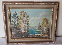 Front view of framed oil on board landscape