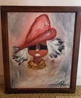 Full view of framed oil painting showing subject, signature, frame