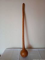 Full view of long‐handled calabash maraca standing upright