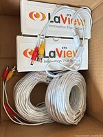 Two boxed LaView cables with two coiled white cables showing BNC and DC connectors