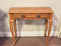 front view of side table showing drawer and legs