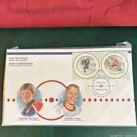 Front view of sealed pack showing portraits, stamps, and cancel