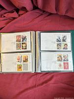 Album pages showing four Millennium first day covers