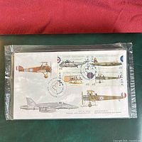 Front of sealed package showing four aircraft stamps and covers