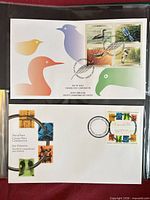 Both First Day Covers in sleeve showing full cachets and stamps