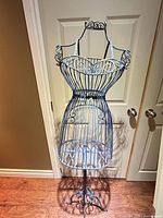 Full front view of wire dress form showing overall design and height reference