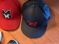 Red and black caps top view showing logos