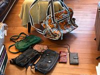 Full group view showing ROXY bag, four handbags, two wallets