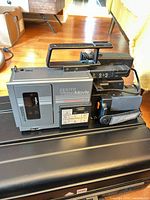 Left profile of Zenith VM6100 camcorder on hard case