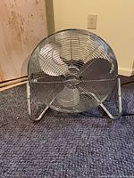 Front view of Lakewood metal floor fan showing cage and blades