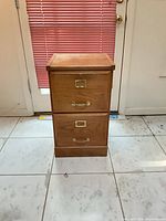 Front view showing two drawers with metal hardware