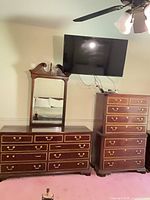 dresser with mirror and highboy chest visible