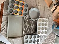 Top view of all seven pans laid out on table