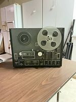 Front view showing controls and mounted take-up reel