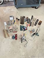 Overhead view of all tools and hardware spread on floor