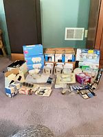 Overall lot showing boxes of Westinghouse, Philips, Sylvania bulbs and fixtures